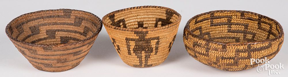 Appraisal: Three Southwestern coiled baskets one having huma Three Southwestern coiled