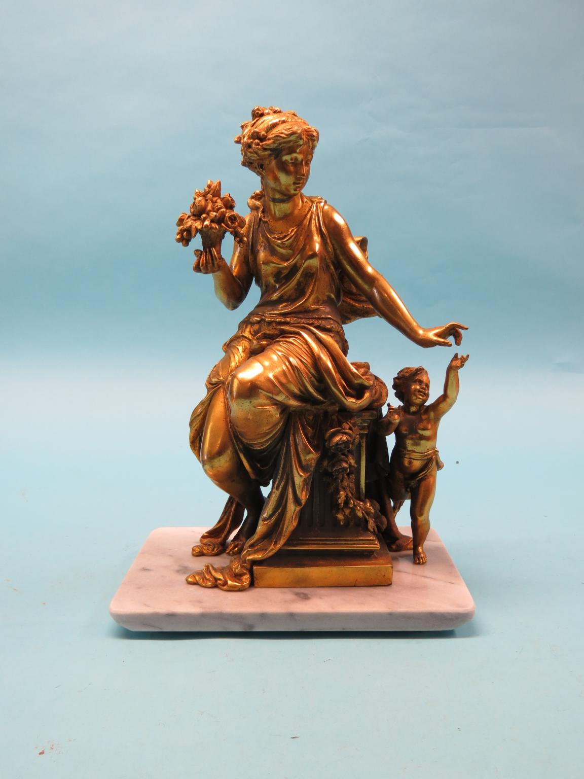 Appraisal: A gilt-metal figure group seated female and young child on