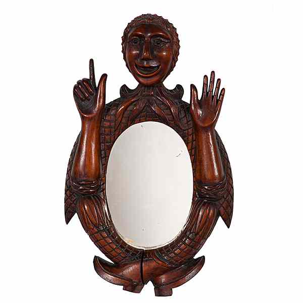 Appraisal: Folk Art Carved Figural Mirror American th century A carved