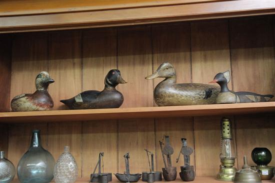 Appraisal: GROUP OF FOUR CARVED AND PAINTED DUCK DECOYS Including one