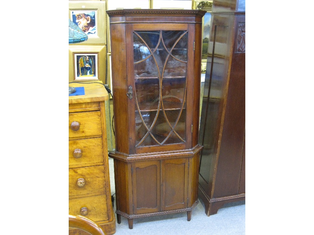 Appraisal: Victorian mahogany astragal glazed door corner cabinet with cupboard base