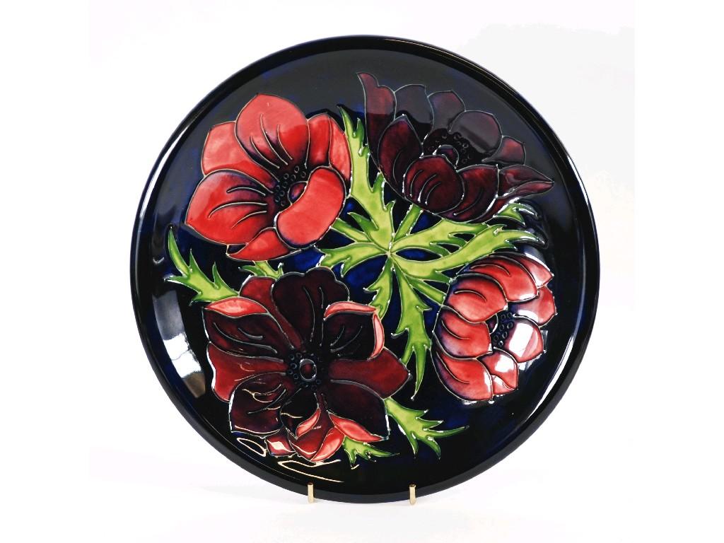 Appraisal: MODERN MOORCROFT 'ANEMONE' PATTERN TUBE LINED POTTERY PLATE decorated with