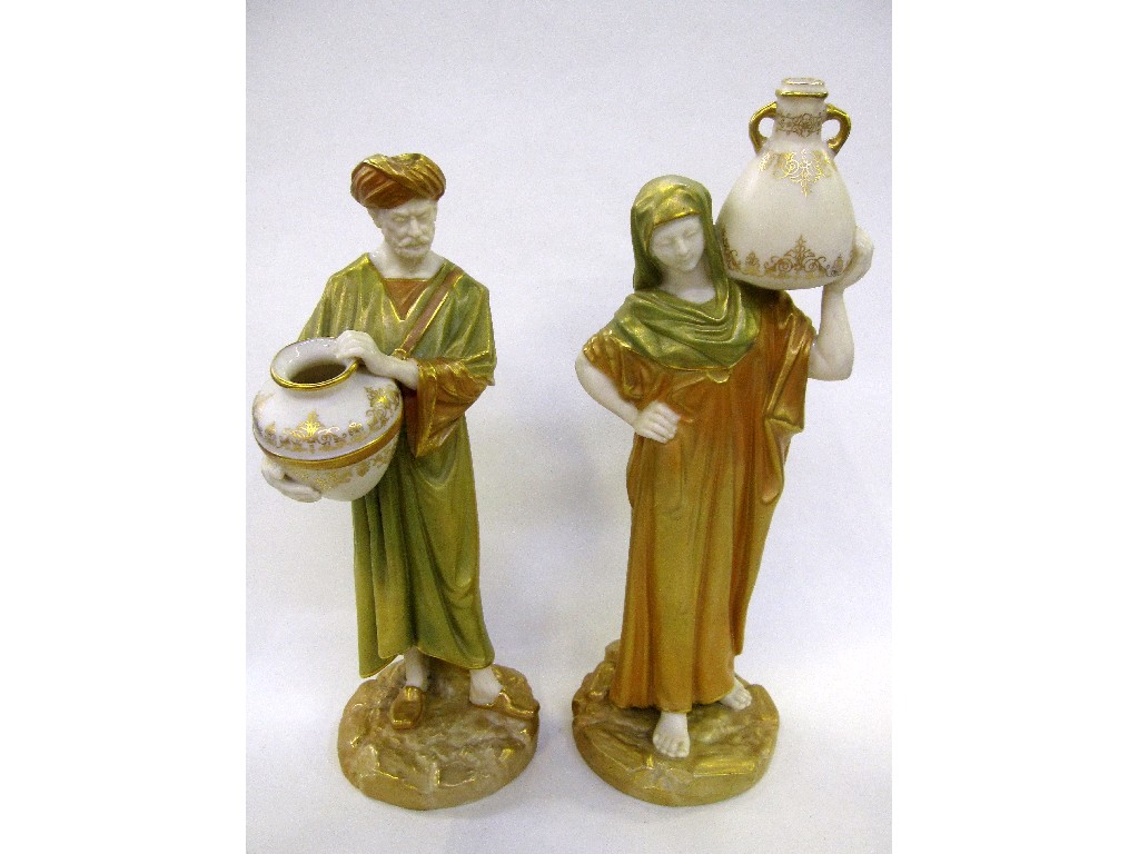 Appraisal: Pair of Royal Worcester figures of water carriers printed and