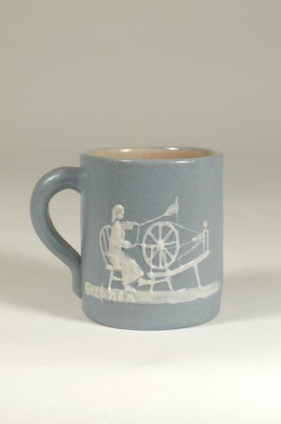 Appraisal: Signed Pisgah Forest Cameo mug with woman at the spinning