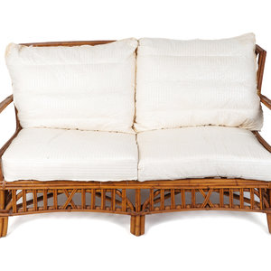 Appraisal: A Contemporary Rattan Settee Height x length inches Collection of