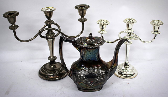 Appraisal: A VICTORIAN SILVER PLATED FOUR PIECE TEA SET with chased