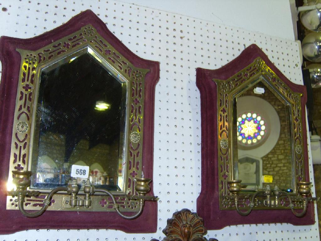 Appraisal: A pair of th century bevelled mirrors with lancet shaped