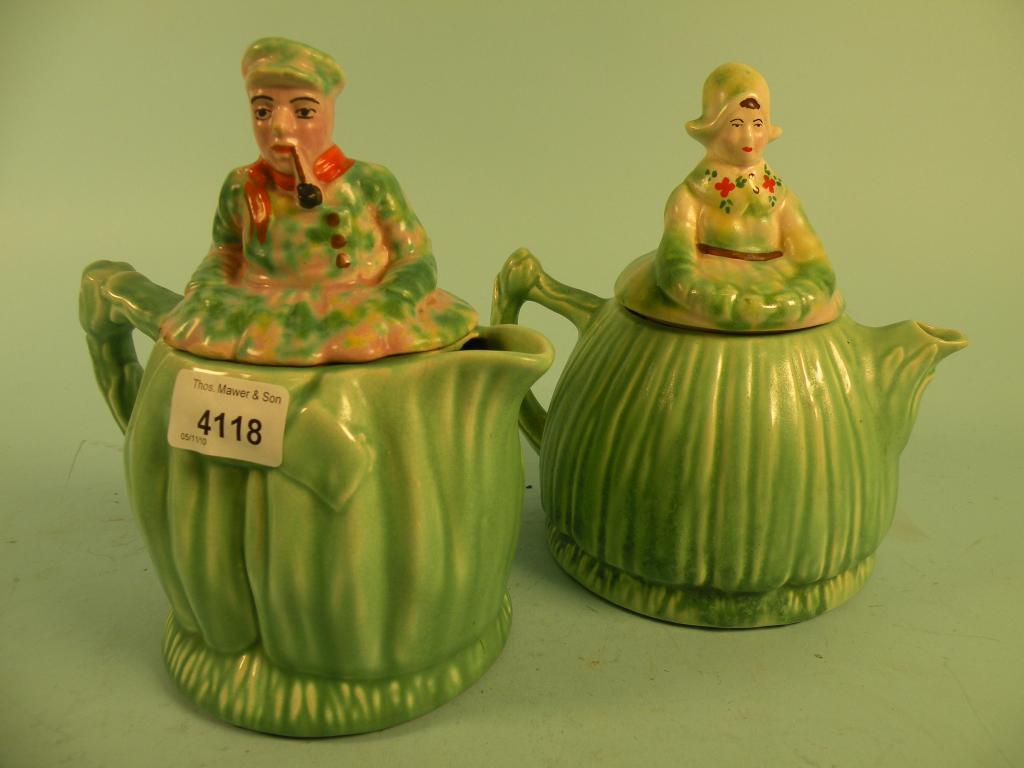 Appraisal: A pair of Arthur Wood 's teapots each in the