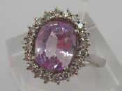 Appraisal: An carat white gold pink sapphire and diamond cluster ring