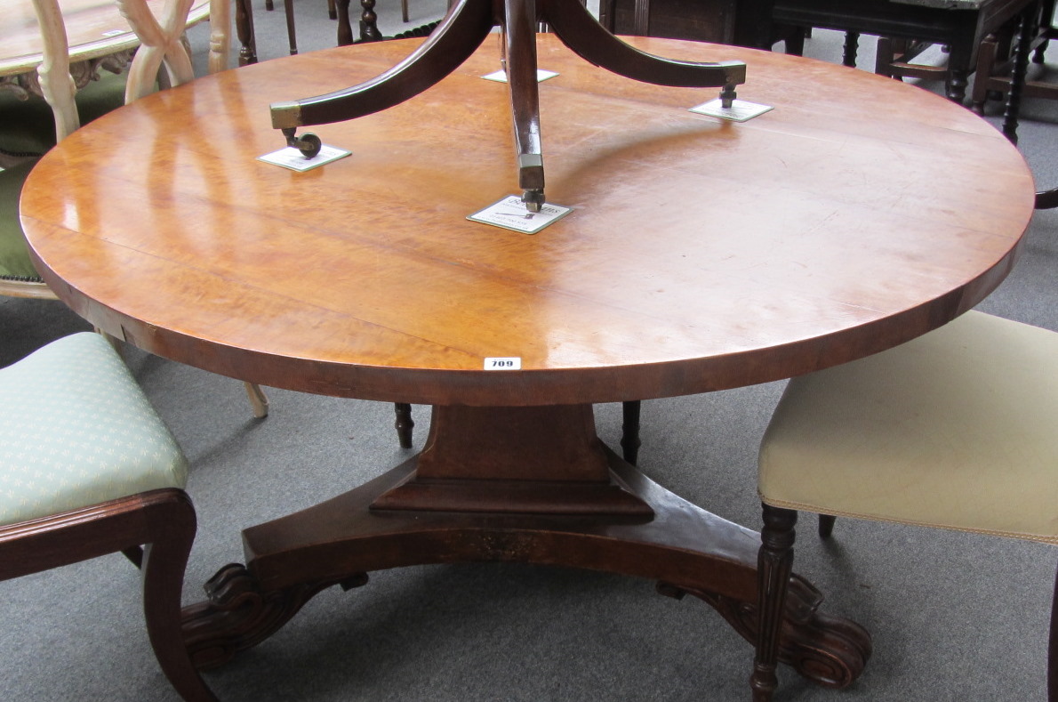 Appraisal: An early Victorian satin birch centre table with circular snap-top