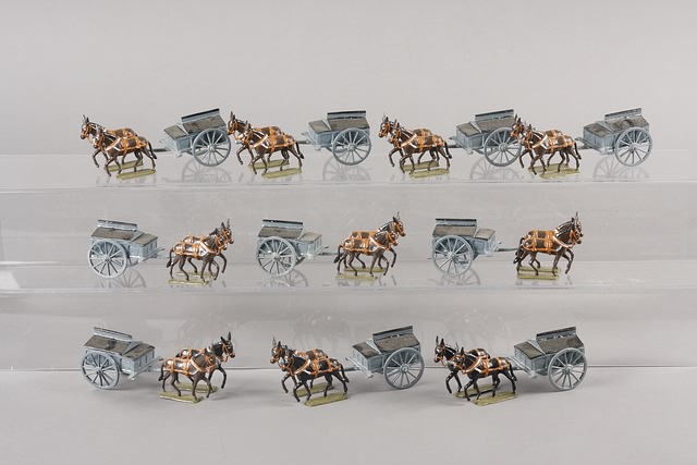 Appraisal: Lot of metal limbers with pulling mules painted gloss Estimated