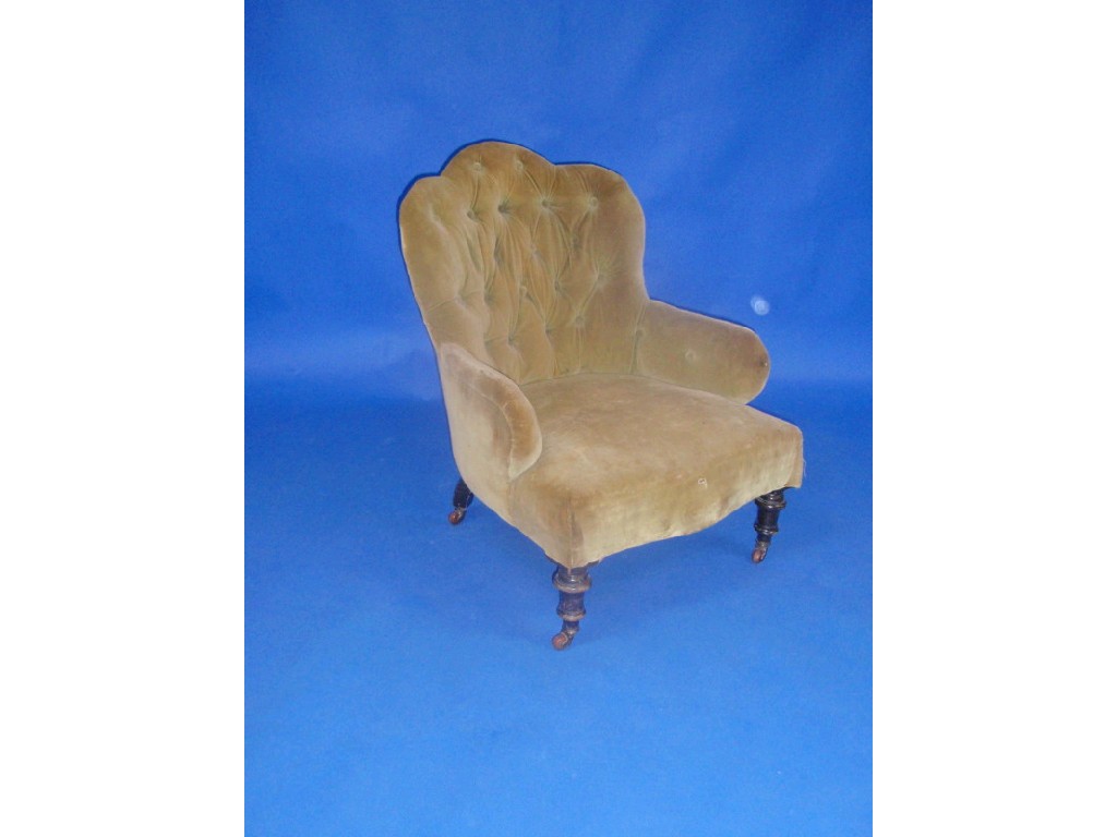 Appraisal: A Victorian button velvet upholstered armchair