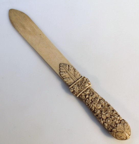 Appraisal: A thC Chinese ivory letter opener the heavily carved handle