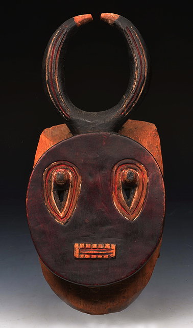 Appraisal: AN AFRICAN BAULE CARVED WOODEN MASK with red painted face