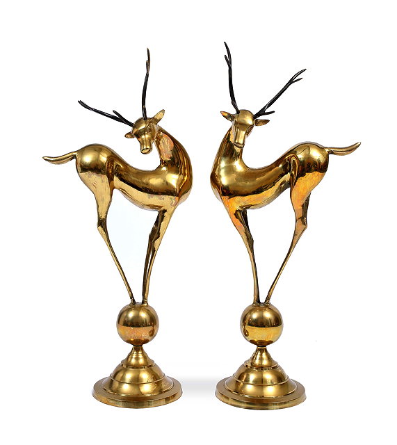 Appraisal: A PAIR OF DECORATIVE BRASS SCULPTURES OF DEER each standing