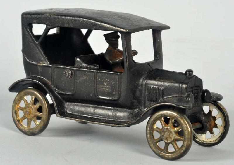 Appraisal: Cast Iron Arcade Sedan Toy American Nickel wheels and driver