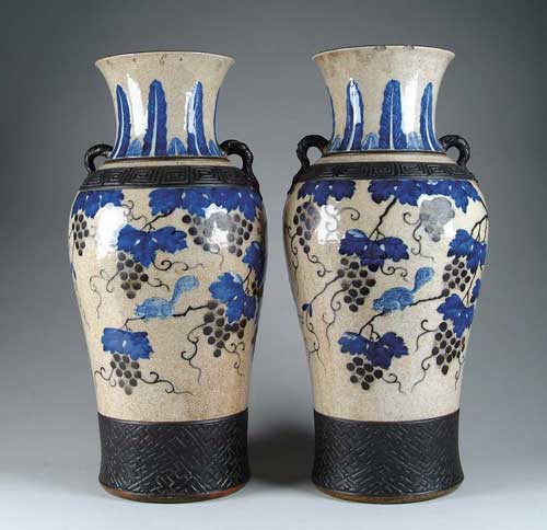 Appraisal: PAIR OF ORIENTAL LARGE VASES Decorated with black grapes and