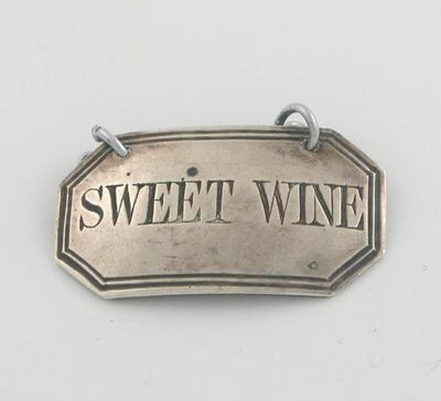 Appraisal: A Victorian canted oblong wine label with a thread border