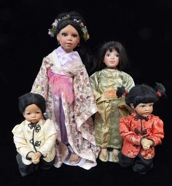 Appraisal: DOLLS Four pieces two Oriental kneeling dolls one dressed in