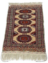 Appraisal: Another Small Turkmen Rug This rug features classic turkmen repetitive