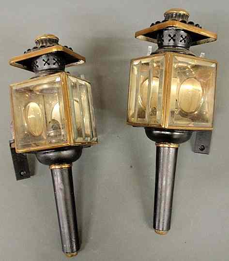 Appraisal: Two small metal carriage lamps with oil burners marked ELC