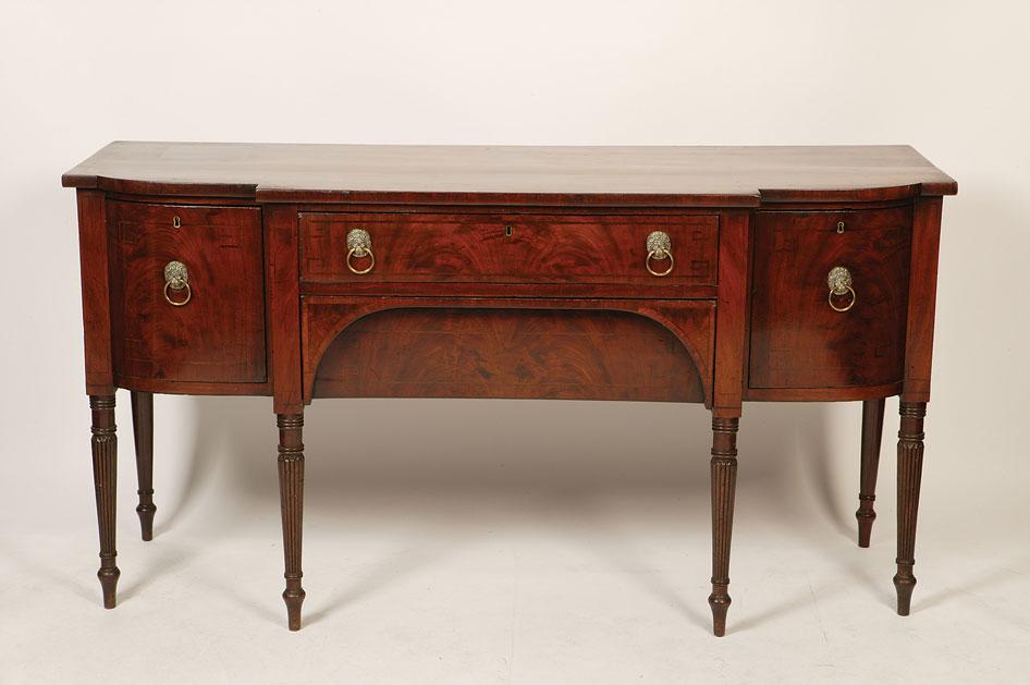 Appraisal: A LATE GEORGE III MAHOGANY BREAKFRONT SIDEBOARD the rectangular top