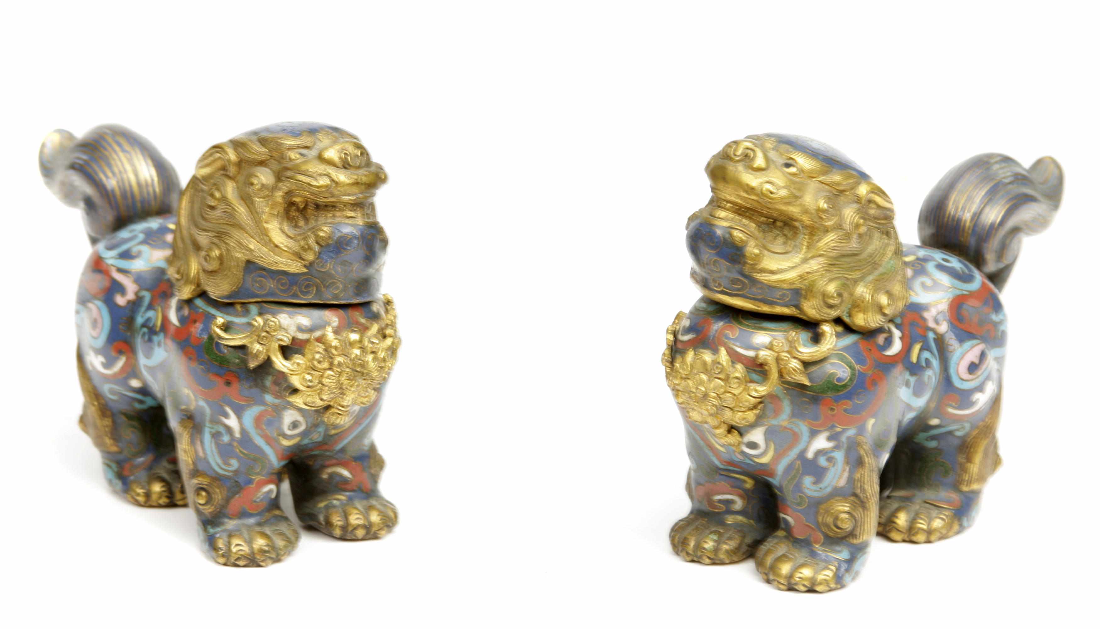 Appraisal: A pair of small Chinese cloisonn Buddhist lion censers height