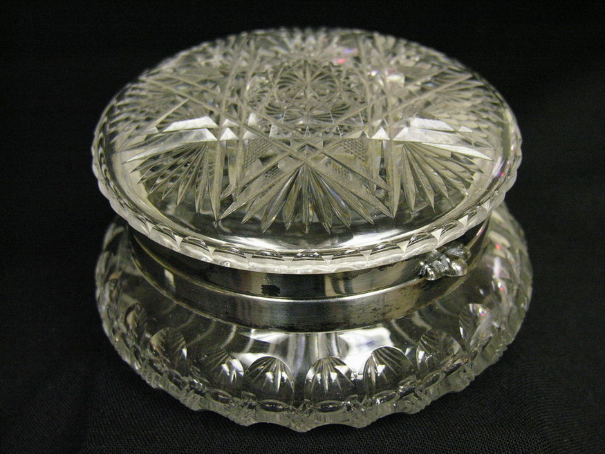 Appraisal: CUT GLASS POWDER JAR Eight point star in lid Hinged