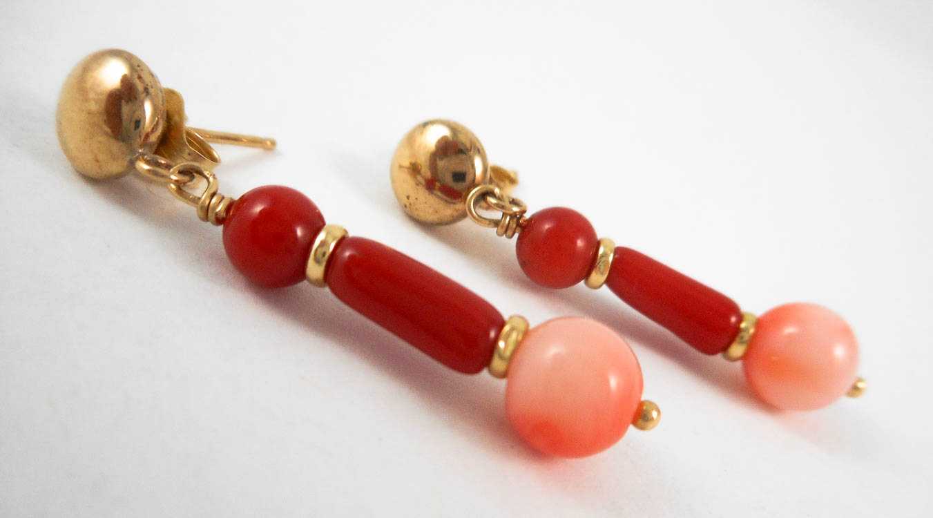 Appraisal: PINK AND RED CORAL DANGLE EARRINGS each with two red