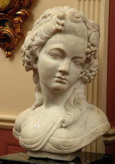 Appraisal: A LARGE CARVED MARBLE BUST OF A MAIDEN Carved with