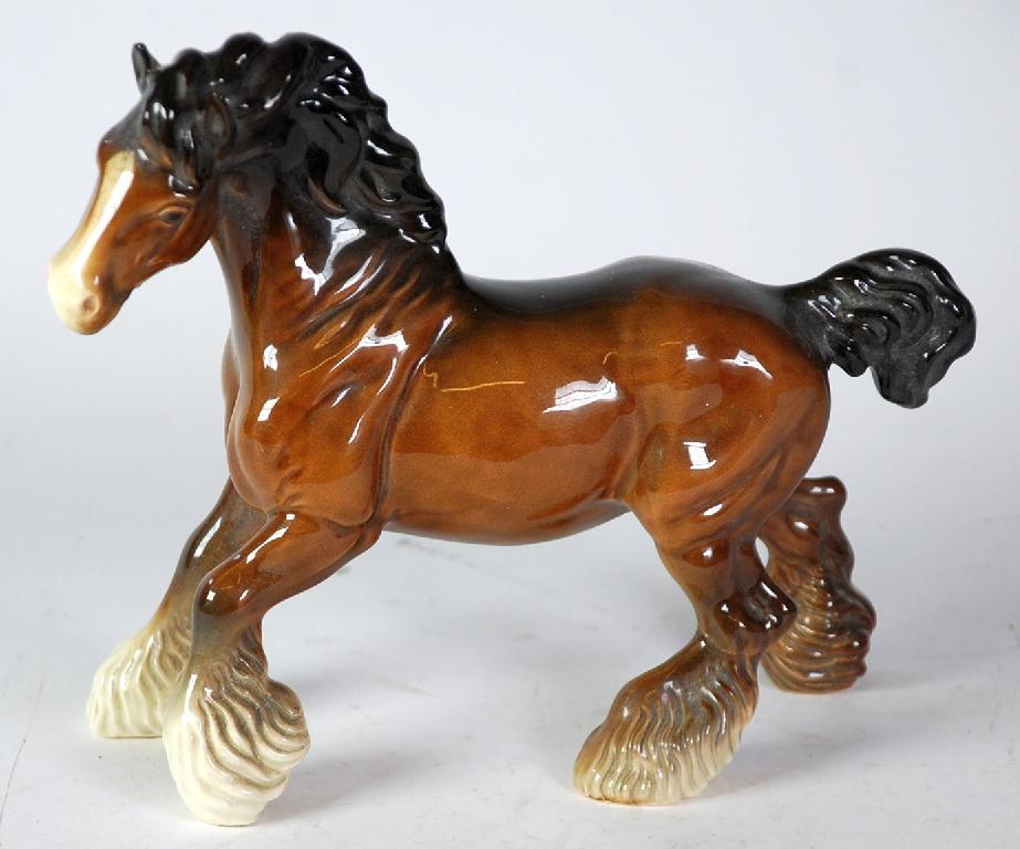 Appraisal: BESWICK POTTERY MODEL OF A CANTERING SHIRE brown gloss in