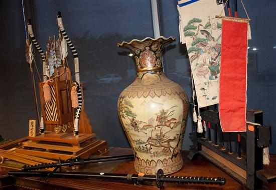 Appraisal: Two Samurai swords Satsuma style vase Japanese bow and arrow