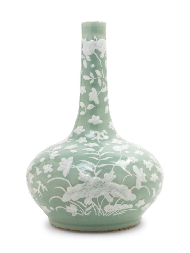 Appraisal: A Celadon Ground White Slip-Decorated Porcelain Bottle Vase Height in