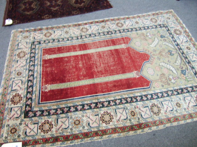 Appraisal: A Ghiordes silk prayer rug Turkish the plain madder mehrab