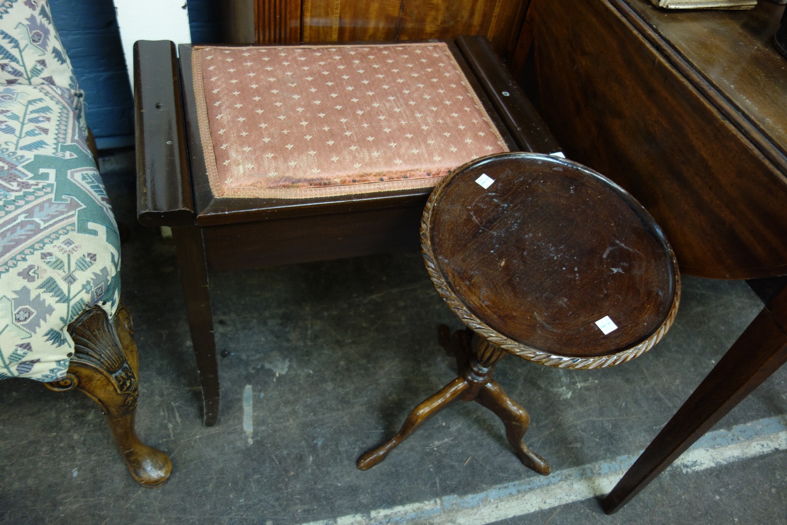 Appraisal: A mahogany piano stool with hinged compartment seat three other