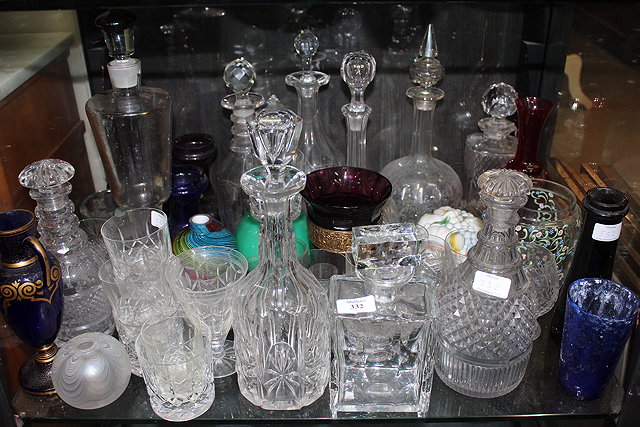 Appraisal: A COLLECTION OF GLASSWARE to include cut glass decanters tumblers