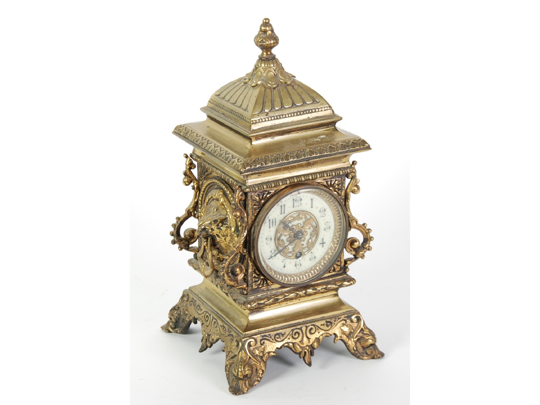 Appraisal: AN ORNATE VICTORIAN BRASS CASED MANTLE CLOCK drum shaped movement