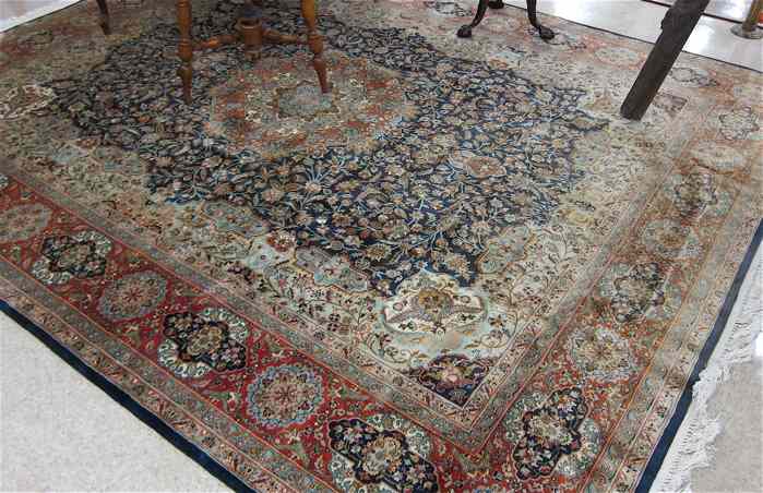 Appraisal: HAND KNOTTED ORIENTAL CARPET Pakistani Persian floral and central floral