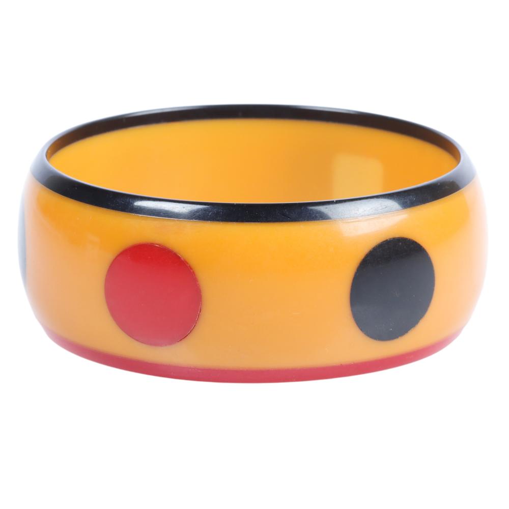 Appraisal: BAKELITE ARTISAN CREAM BANGLE BRACELET WITH LAMINATED RED BLUE DOTS