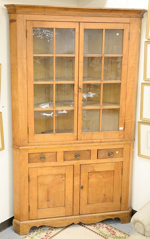 Appraisal: Large two piece tiger maple corner cabinet ht in wd