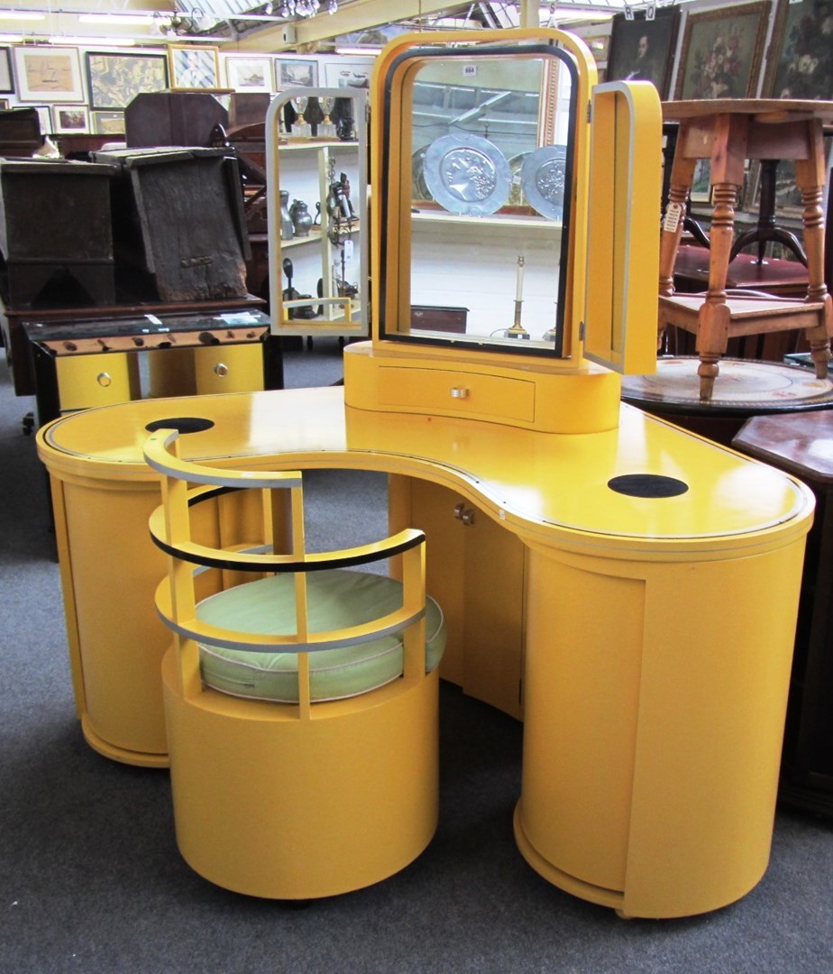 Appraisal: An Art Deco style yellow lacquered corner dressing table with