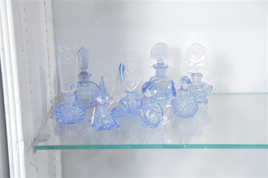 Appraisal: NINE CZECH BLUE GLASS MINIATURE PERFUME BOTTLES Each with blue