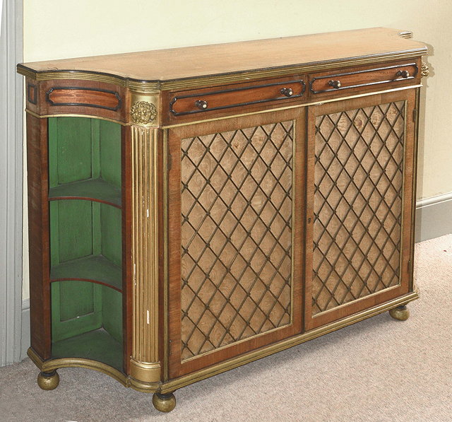 Appraisal: A GEORGE IV SATINWOOD SERPENTINE SIDE CABINET with walnut crossbanded