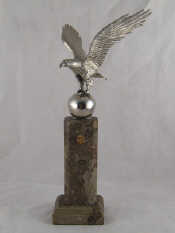 Appraisal: A cast model eagle on a globe the American arms