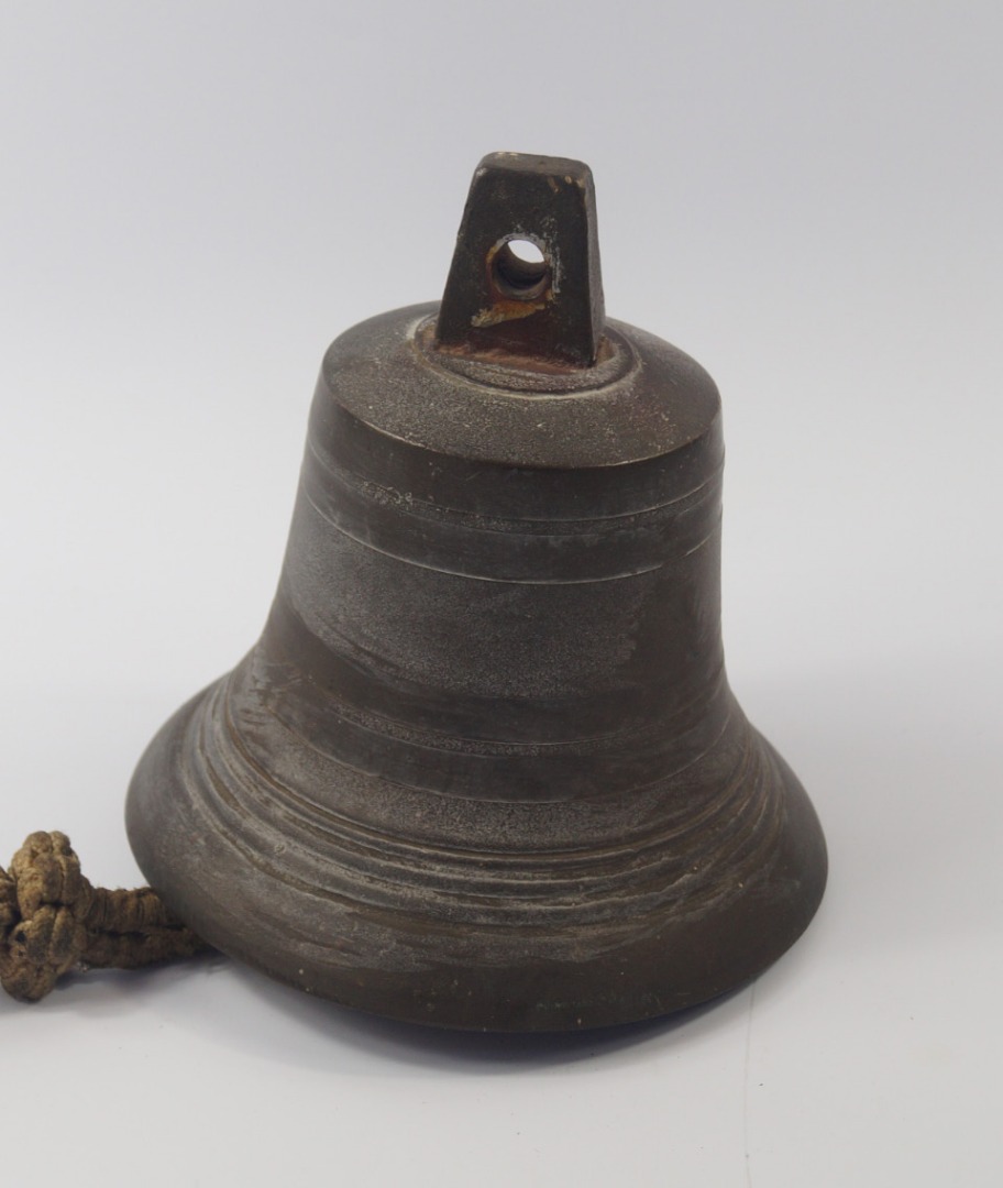 Appraisal: A brass ship's bell with an ornately knotted rope pull