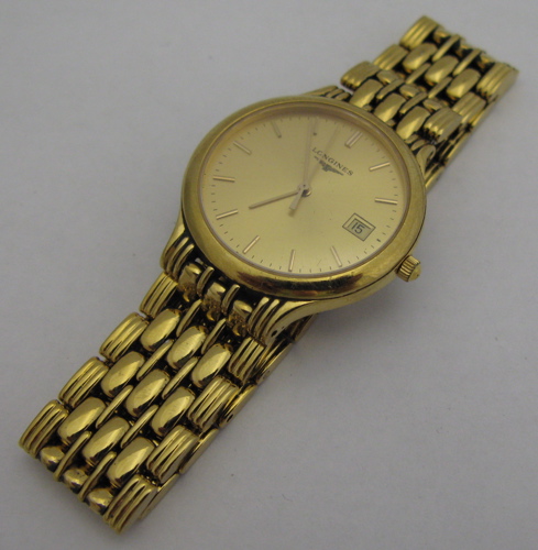 Appraisal: MAN'S LONGINES WRISTWATCH model L gold dial with baton numerals