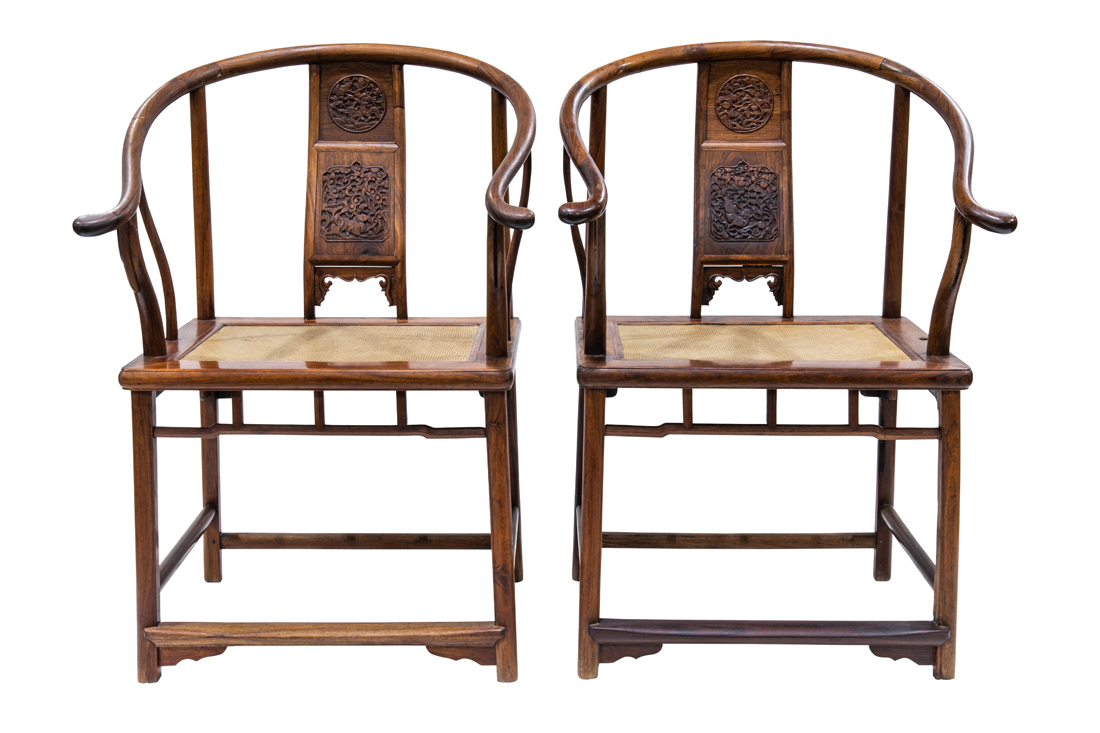 Appraisal: PAIR OF CHINESE HUANGHUALI HORSESHOE-BACK ARMCHAIRS Pair of Chinese huanghuali