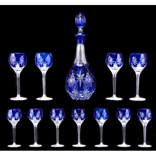 Appraisal: A blue cased and cut glass decanter and stopper and