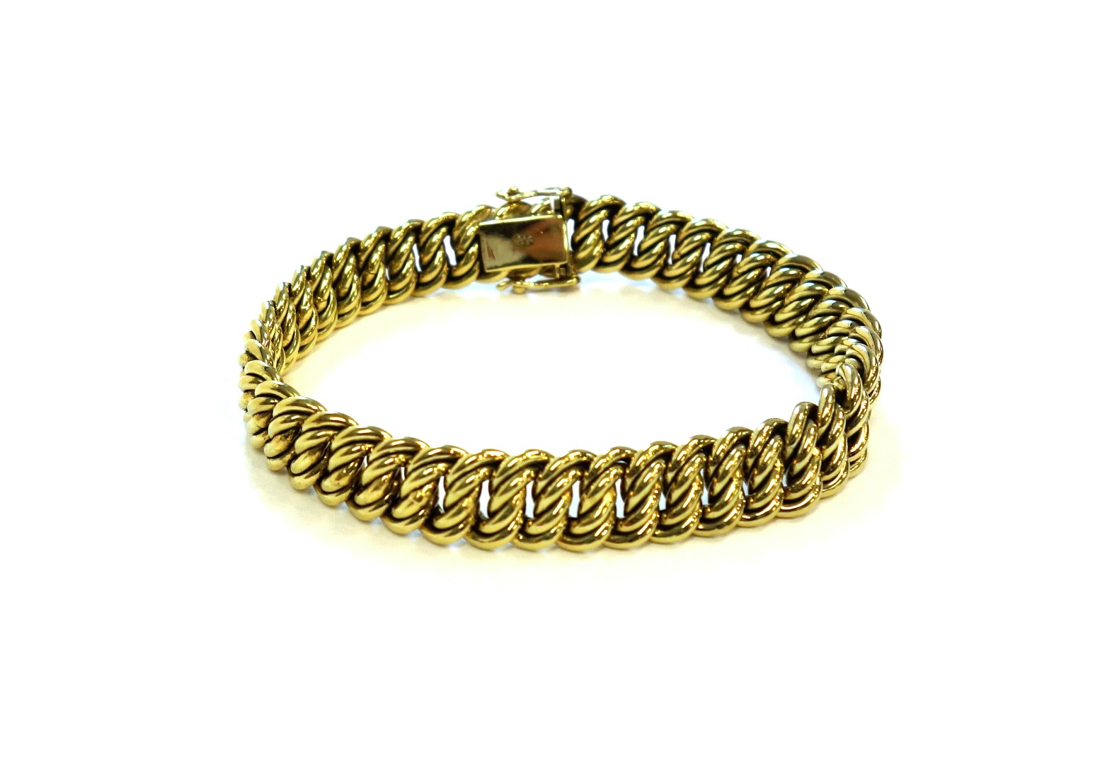 Appraisal: A gold bracelet in a multiple twisted oval link design