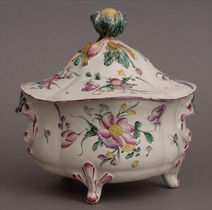 Appraisal: FAIENCE ROCOCO-STYLE TUREEN AND COVER The bowl modeled with c-scroll